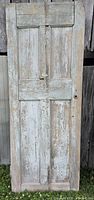 Full front view of weathered wooden door
