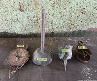 Group shot of feed scale, butter churn dash, funnel, pulley