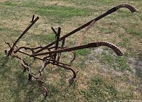 Three-quarter side view showing full frame, twin handles and tines