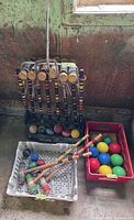 Adult croquet set and children’s set with extra balls in crates