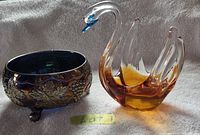 Indiana Glass footed bowl and lead crystal swan bowl side by side