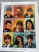 Sheet of nine Beatles stamp portraits from Republic of Tchad, each showing a different band member with colorful backgrounds and denomination of 300F