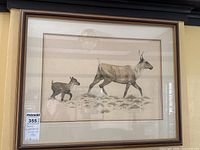 Framed original drawing featuring two caribou figures walking, signed and dated by Donna Weatherall in 1981.