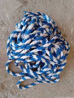 Photo of coiled blue and white braided rope showing texture and color pattern.