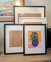 Four IKEA RIBBA frames displayed together showing black and white frames in different sizes with matting inside.