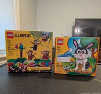 Two brand new LEGO animal-themed sets displayed side by side: LEGO Classic 11031 Creative Monkey Fun and LEGO 40575 Year of the Rabbit.