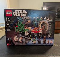 Photo of a new LEGO Star Wars Millennium Falcon Holiday Diorama set 40658 box showing front with festive Star Wars holiday scene and minifigures.