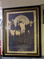 Framed poster showing the band The Tragically Hip with 'Long Time Running' title.