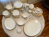 Overall view of all dinnerware pieces arranged on table
