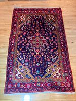 Full top-down view of rug on wooden floor