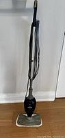 Front view of Shark Euro-Pro steam mop upright with mop pad attached to base