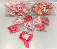 All bracelet packets laid out, one bracelet displayed assembled