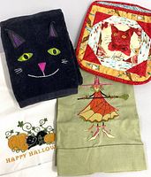 group shot of all four Halloween kitchen linens