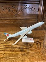 Side angle view of the Air Canada airplane model on wooden surface, showing detailed marking and tail logo.