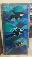 Full view of the rectangular painted glass panel showing three orca whales against an abstract aquatic background with a marbled gray border.