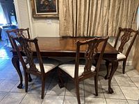 Front view showing table and six chairs