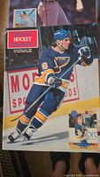 Photo of Beckett Hockey Magazine Winter 1991 cover showing hockey player in blue and yellow uniform on ice.