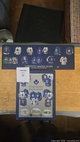 Framed illustration of Toronto Maple Leafs jerseys in blue and white with team logo and text.