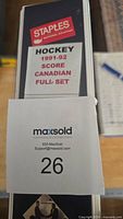 Side view of the binder labeled Staples Canadian Hockey 1991-92 Score Full Set showing thickness filled with cards.