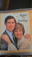 Front cover of the book 'Invitation to a Royal Wedding' showing a close-up of Prince Charles and Princess Diana smiling.