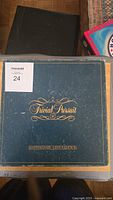 Top view of Trivial Pursuit Master Game Genus Edition box showing gold lettering on blue background.