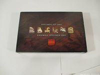 Top closed box with 'Specimen Set 2003' text and images representing Canadian themes.