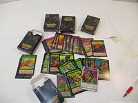 Five packs of Weird N Wild Creatures trading cards with scattered creature cards showing colorful illustrated animals and creatures.