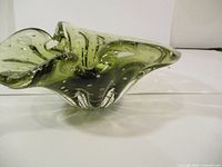 Green art glass bowl with bubbly texture, wavy ruffled edge and organic chalet style shape
