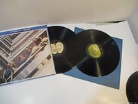Double album cover and two vinyl records laid out, showing original cover artwork and Apple Records labels.