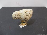 Front left angled view showing the painted details and size of the cast iron chick