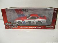 Front view of the 1970 BRE Datsun 240Z diecast model car in original packaging showing the car's racing decals and box design.
