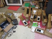 Overview of boxes containing Clover POS terminals, docks, adapters, cables and receipt printer
