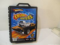 Closed Hot Wheels Color Shifters carrying case showing front artwork with black muscle car and logo