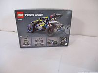 Front view of the LEGO Technic 42164 Off-Road Buggy box displaying the vehicle and smaller images demonstrating mechanics.