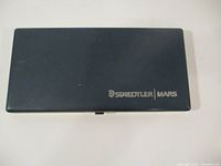 Closed dark blue case of Staedtler Mars drafting set with logo on lid