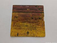 Front cover of Alice Cooper's School's Out LP showing graffiti artwork on a yellowish background with title and artist name.