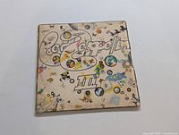 Front cover of Led Zeppelin III LP album with psychedelic artwork and logo.