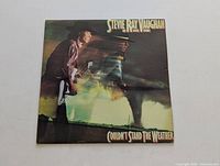 Front cover of LP titled "Couldn't Stand the Weather" by Stevie Ray Vaughan and Double Trouble.