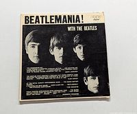 Front cover of Beatlemania! with The Beatles LP. Shows black and white images of the band and title text.