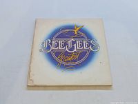 Front image of The Bee Gees Greatest Hits album cover, showing logo and some wear