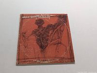 Front cover of Uriah Heep Salisbury LP record showing reddish-brown background with abstract figure illustration and album title in upper left corner.