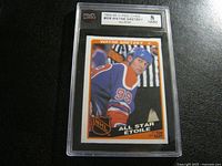 Front view of 1984-85 Wayne Gretzky O-Pee-Chee #208 All-Star hockey card in graded case.