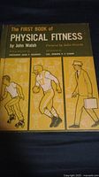 Cover of the book titled 'The First Book of Physical Fitness' showing illustrations of people exercising and walking.