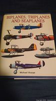 Front cover of the hardcover book showing title and aircraft illustrations.