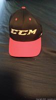 Front view of CCM JetSpeed baseball hat showing logo and red bill.