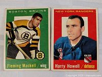 Fleming Mackell and Harry Howell hockey cards showing front sides with player portraits, team names, and positions.