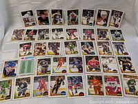 Hockey cards displayed in rows showing player images from the 1987-88 OPC set.