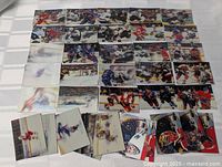 View of multiple 1996 McDonald's hockey cards laid out showing various sports action shots in 3D effect