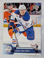 Front view of Connor McDavid hockey trading card in Edmonton Oilers uniform, number 97.