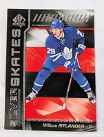 Front side of 2017 Upper Deck SP Authentic Silver Skates William Nylander rookie card showing player in Toronto Maple Leafs uniform skating.